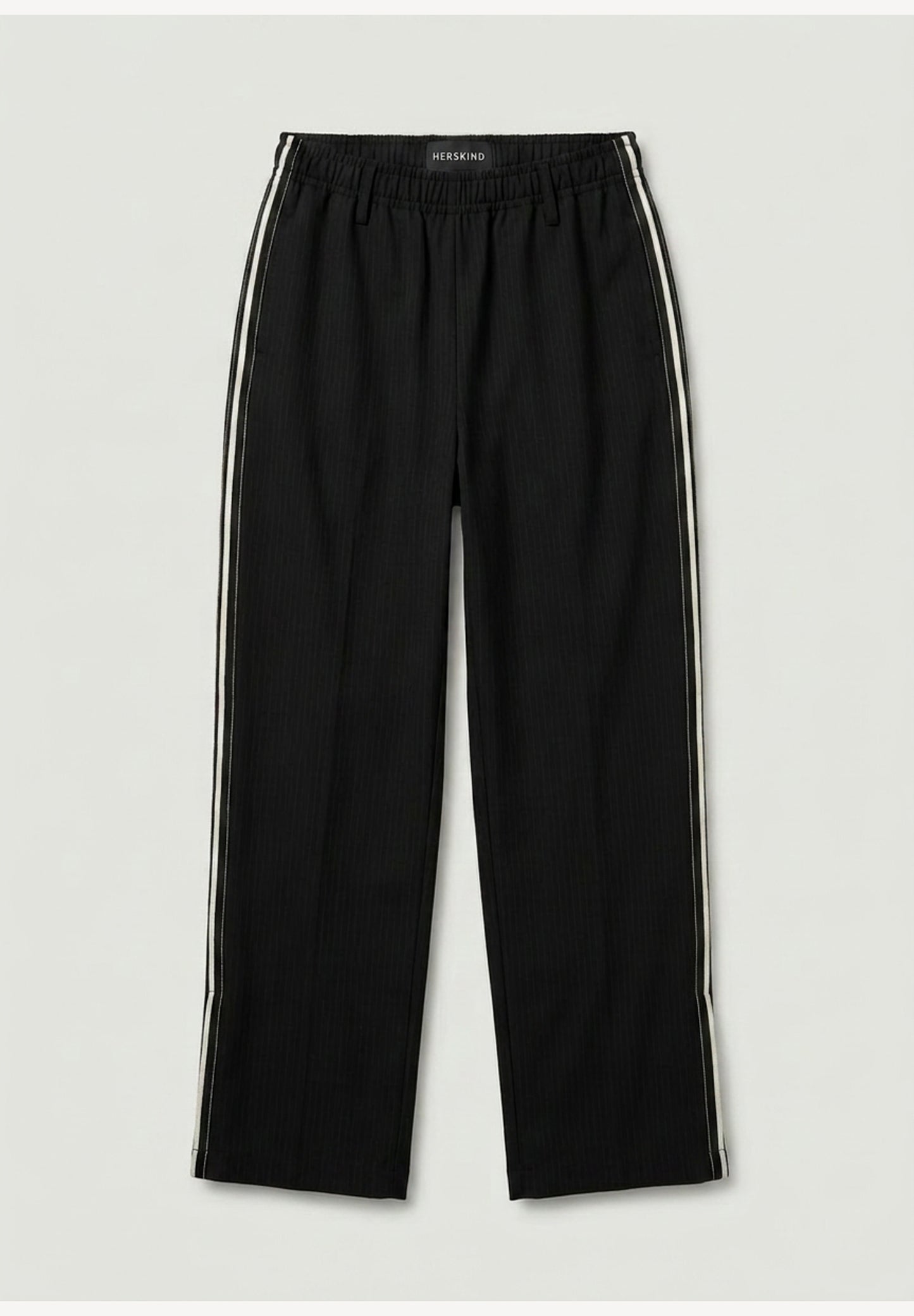 Black pants with white stripes on a light gray background