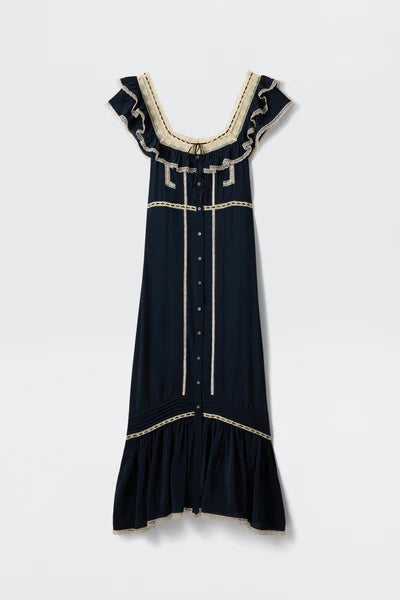 Navy dress with white embroidery on a white background