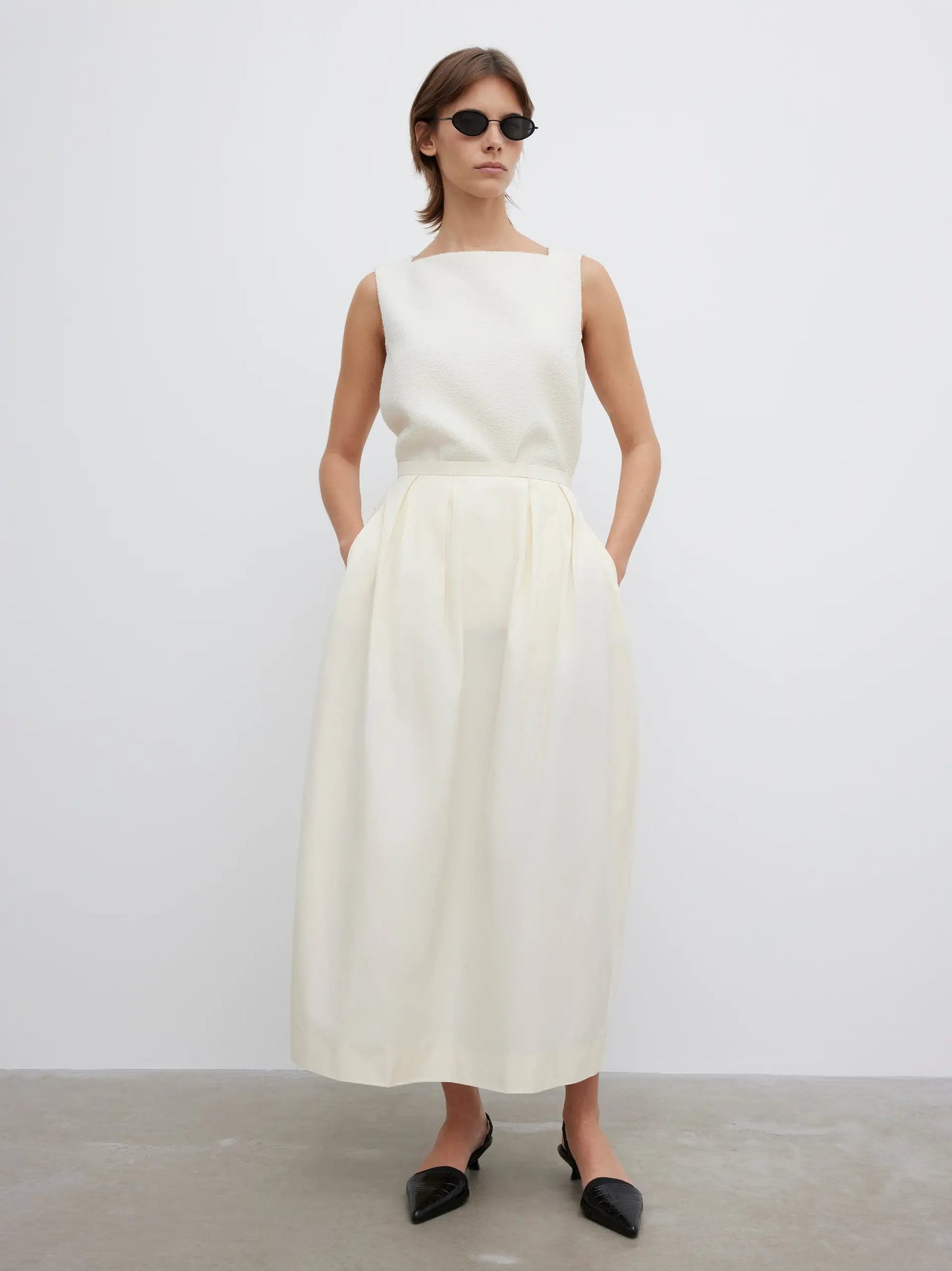 Curved pleated skirt