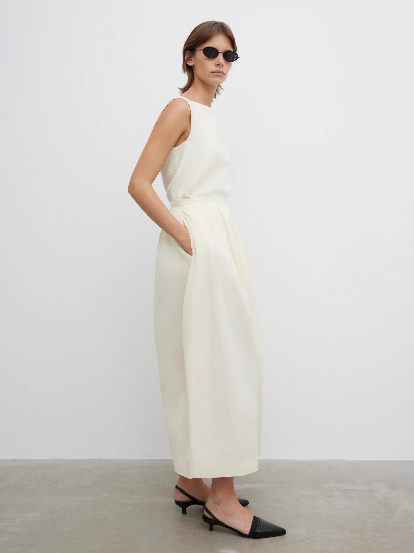 Curved pleated skirt
