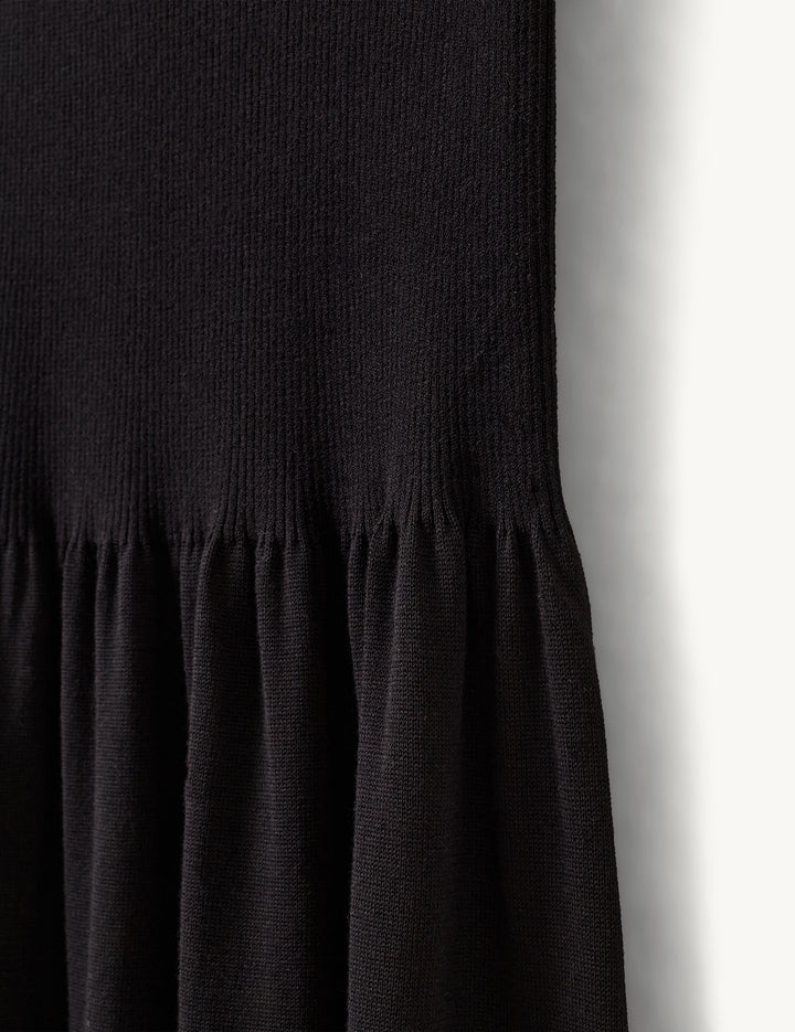 Black dress with a plain background