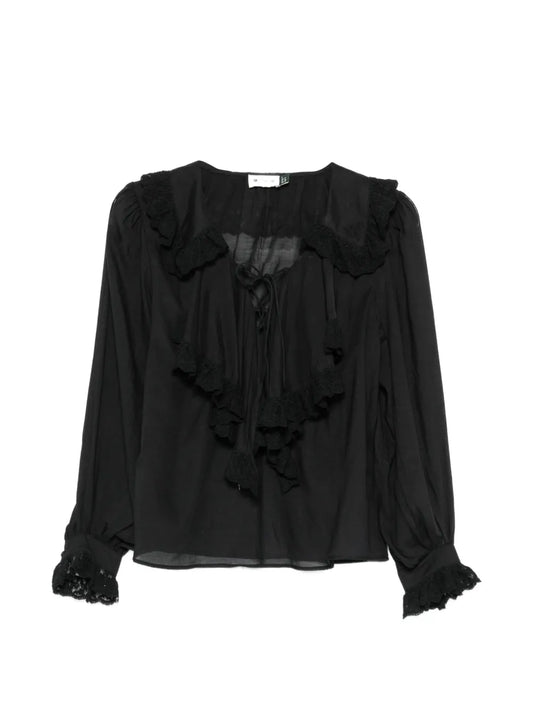 Black blouse with ruffled details on a white background