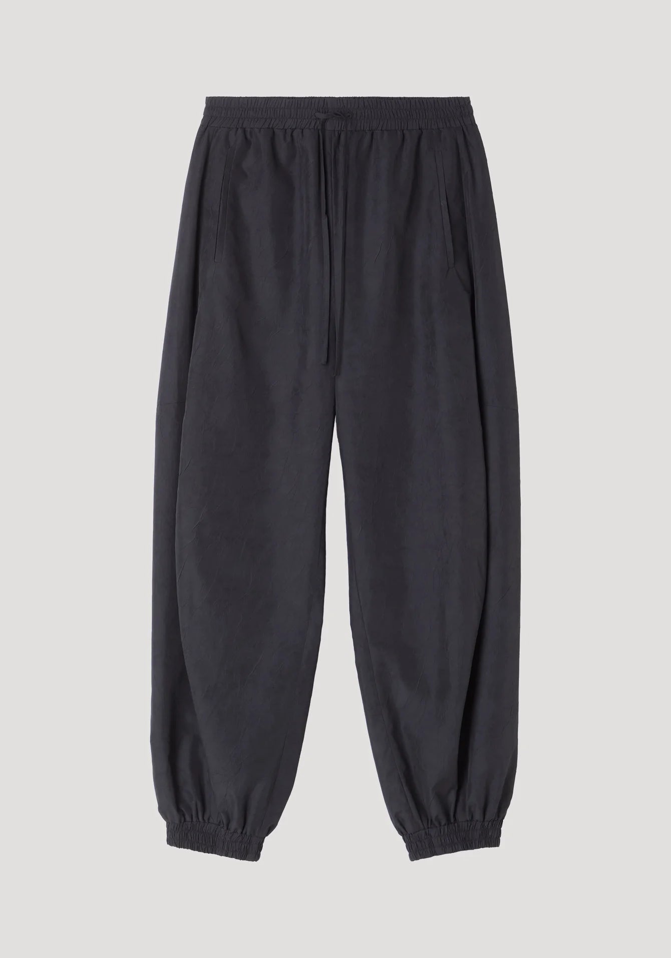 Black jogger pants on a light gray background