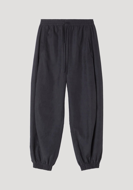 Black jogger pants on a light gray background