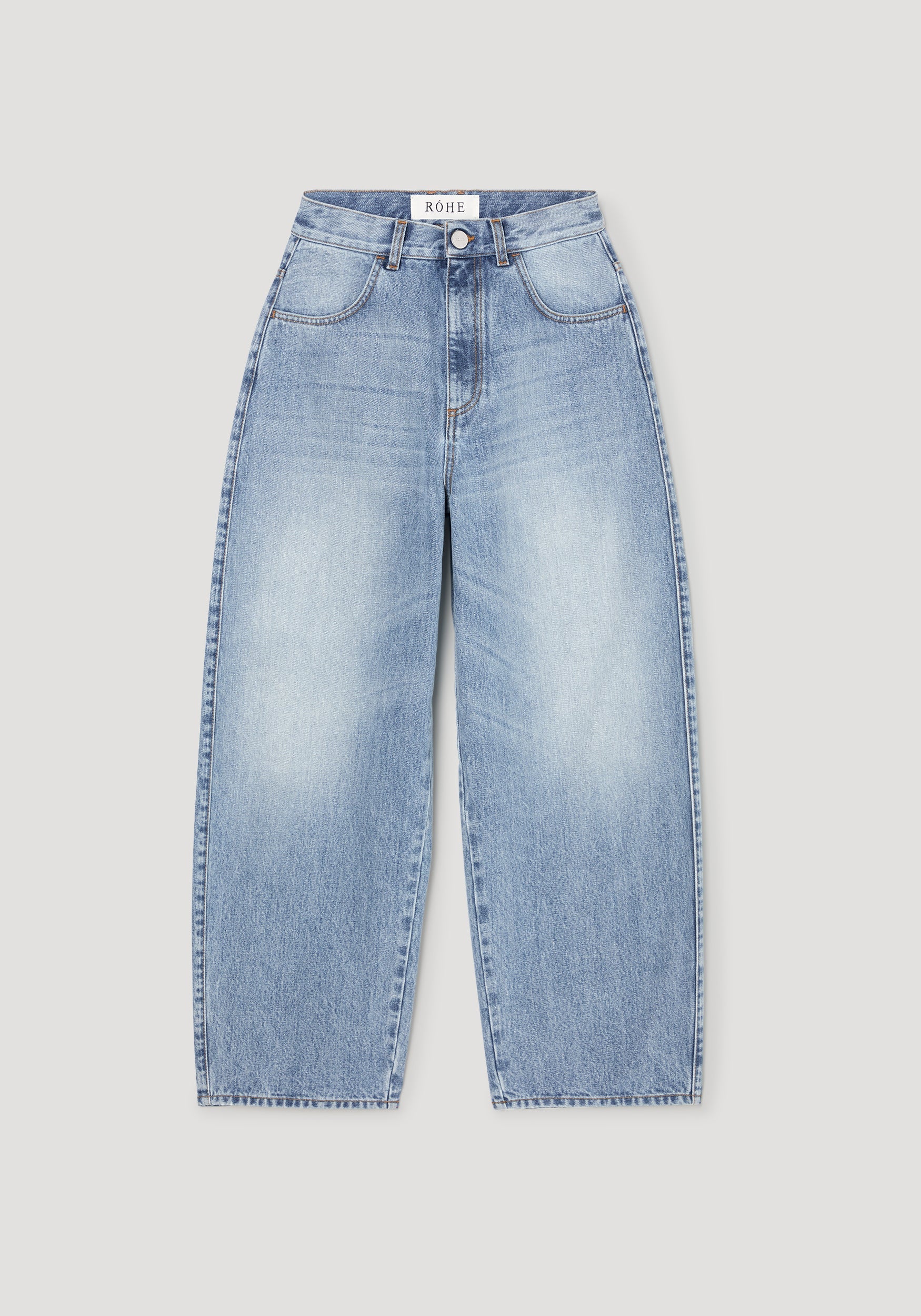 Light blue wide-leg denim jeans with a faded wash, displayed flat against a light gray background. The brand name 'ROEL' is visible on the inner waistband label.