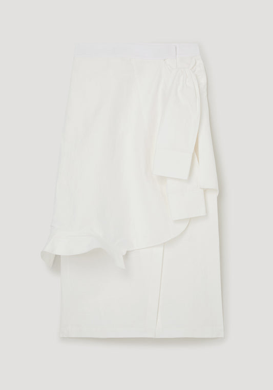 White blouse with ruffled details on a light gray background