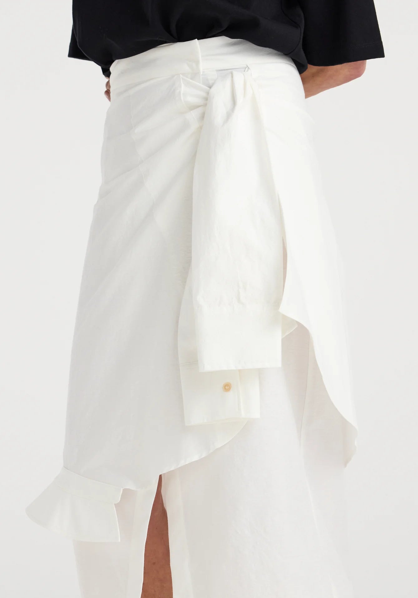 White skirt with a black top on a white background
