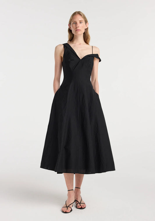 Front view of the Róhe Twisted Shoulder Dress in black featuring an asymmetric sweetheart neckline and twisted shoulder details.
