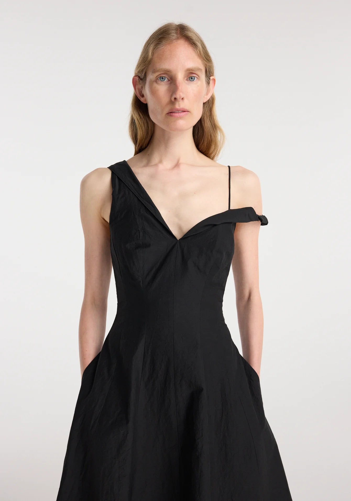 Close up of the twisted shoulder detail and sculptural neckline.