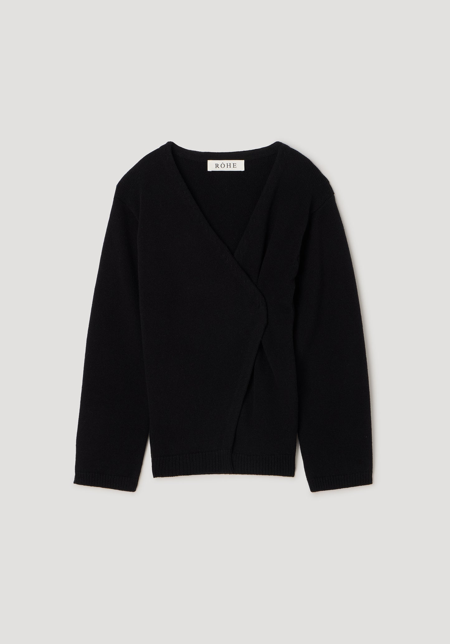 A black knit wrap cardigan sweater with long sleeves and a V-neckline, displayed flat against a light gray background. The brand name 'SALVAT' is visible on the inner neck label.