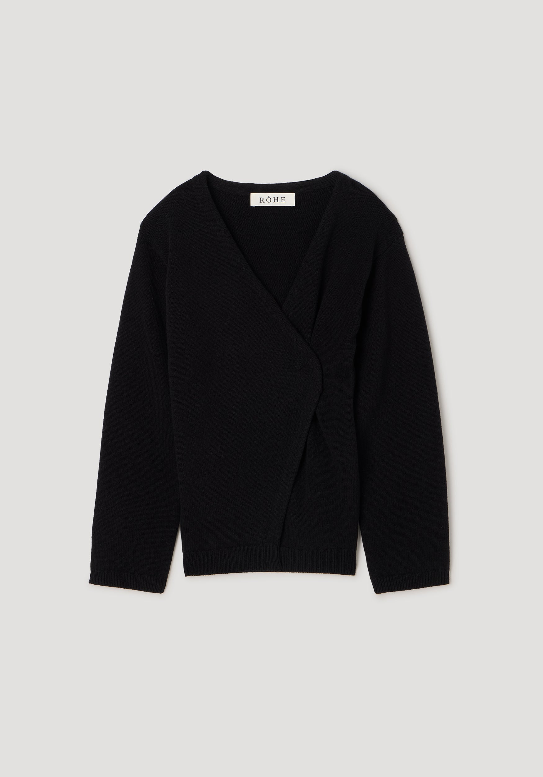 A black knit wrap cardigan sweater with long sleeves and a V-neckline, displayed flat against a light gray background. The brand name 'SALVAT' is visible on the inner neck label.