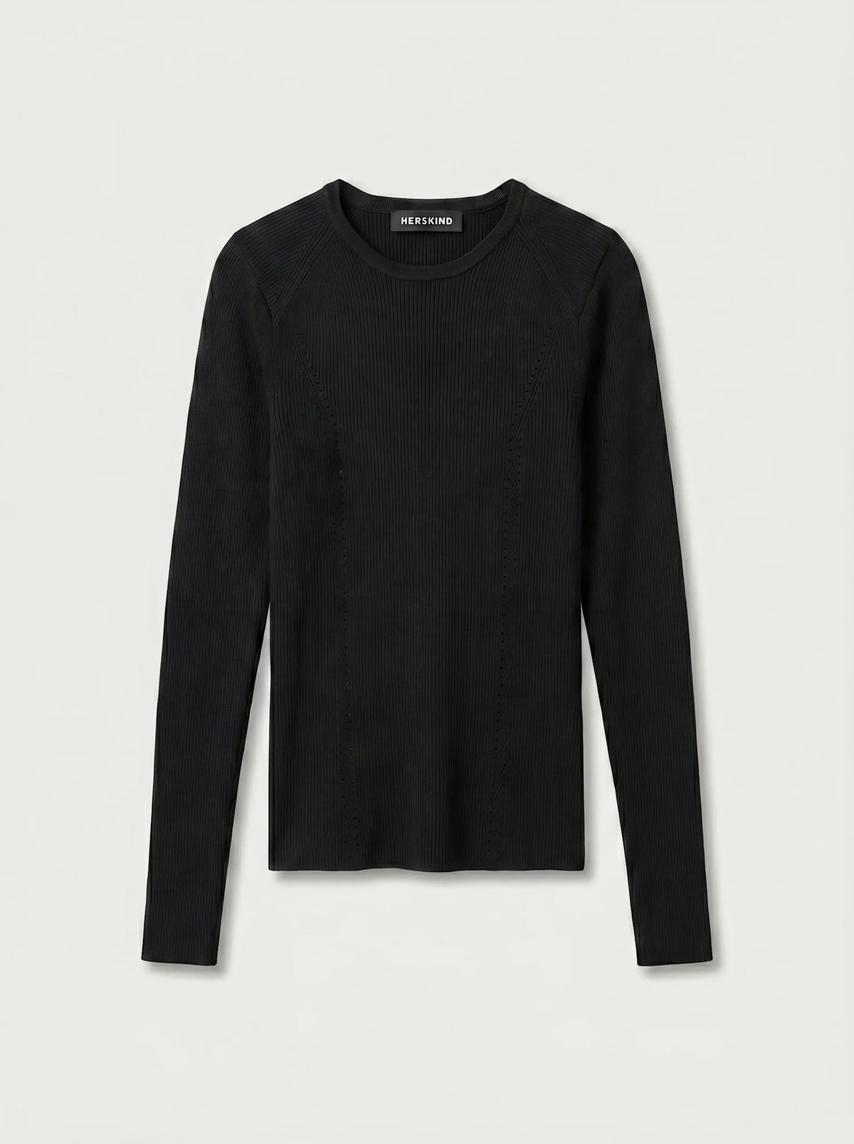 a black long-sleeve top against a plain background