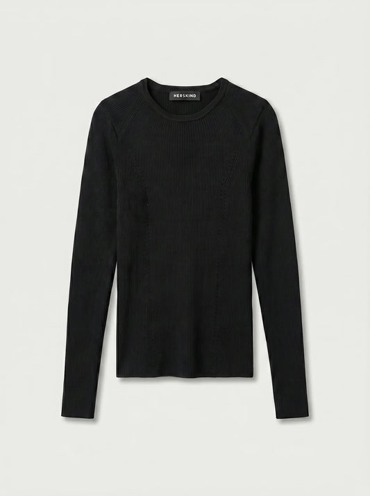 a black long-sleeve top against a plain background