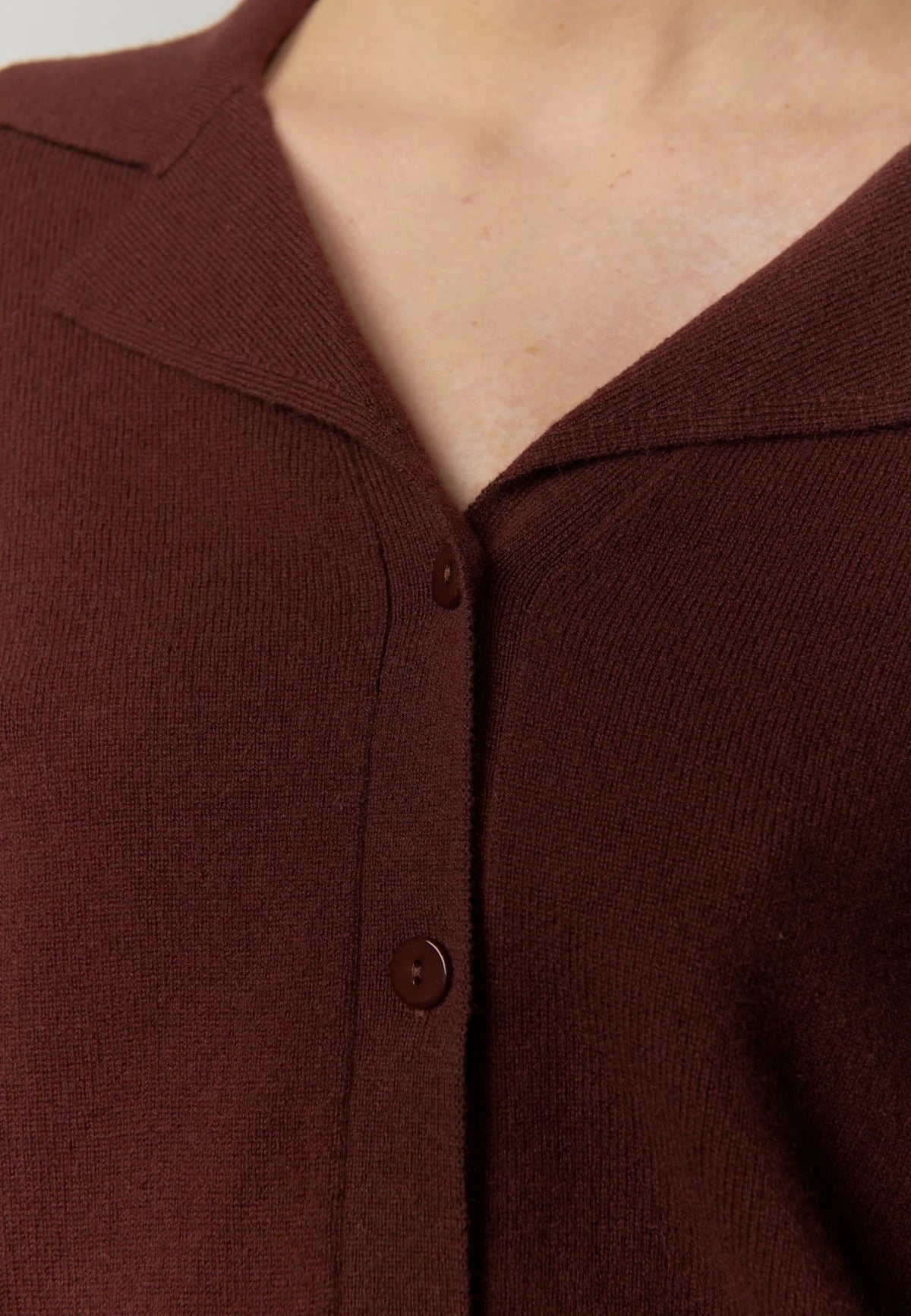 Close-up of a brown button-up garment
