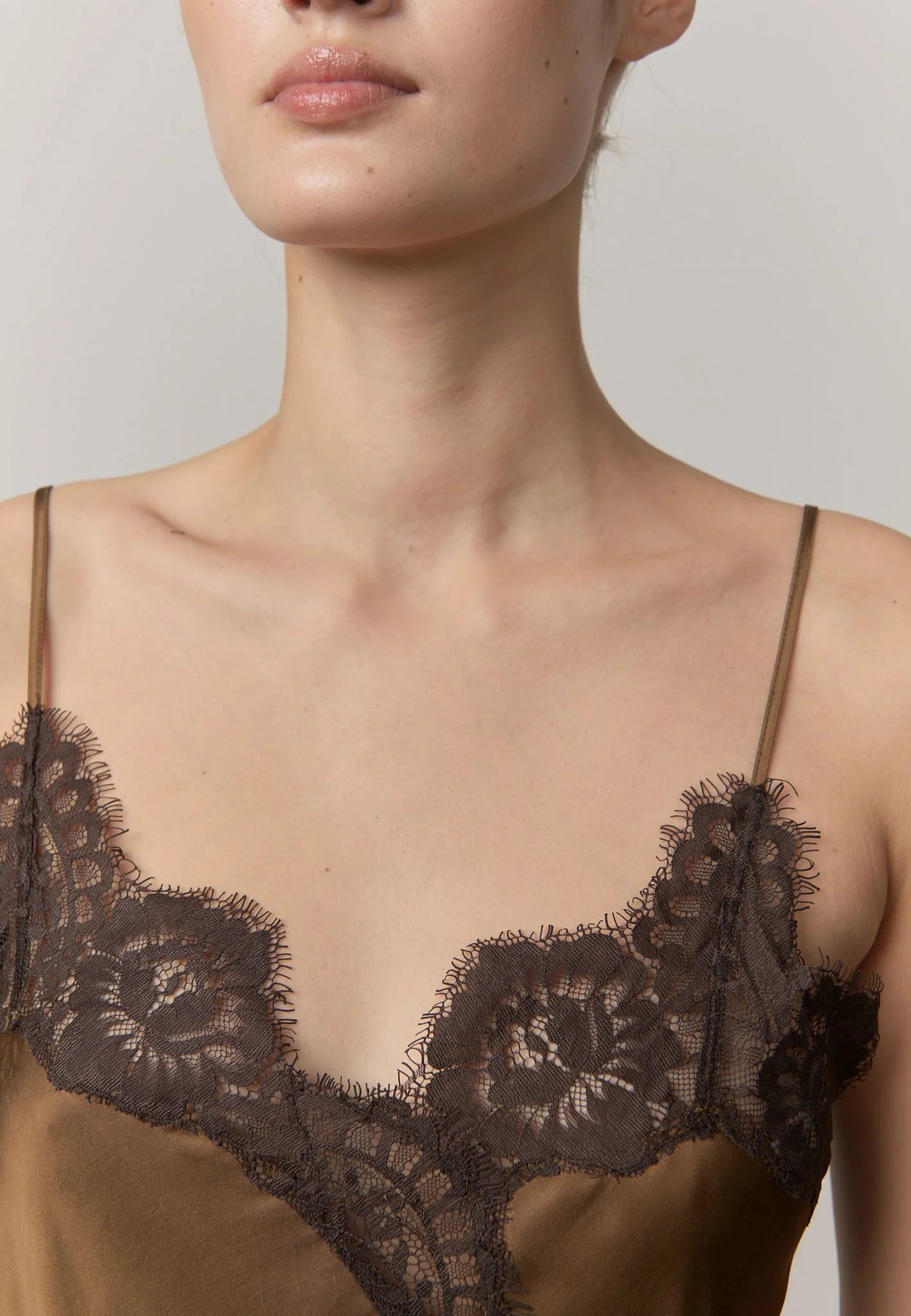 Close-up of the lace neckline and fine straps