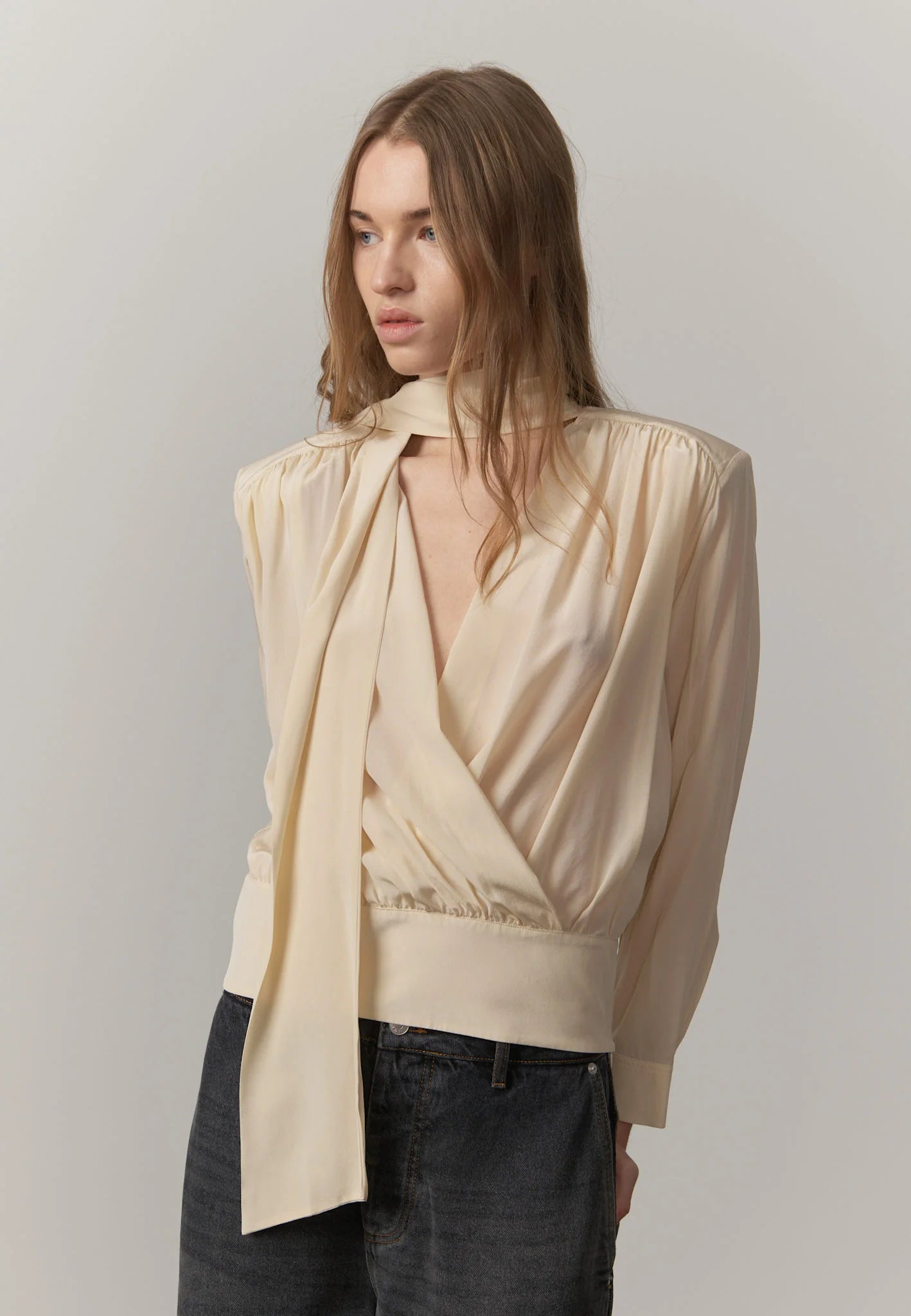 Side view highlighting the relaxed silhouette and fluid drape