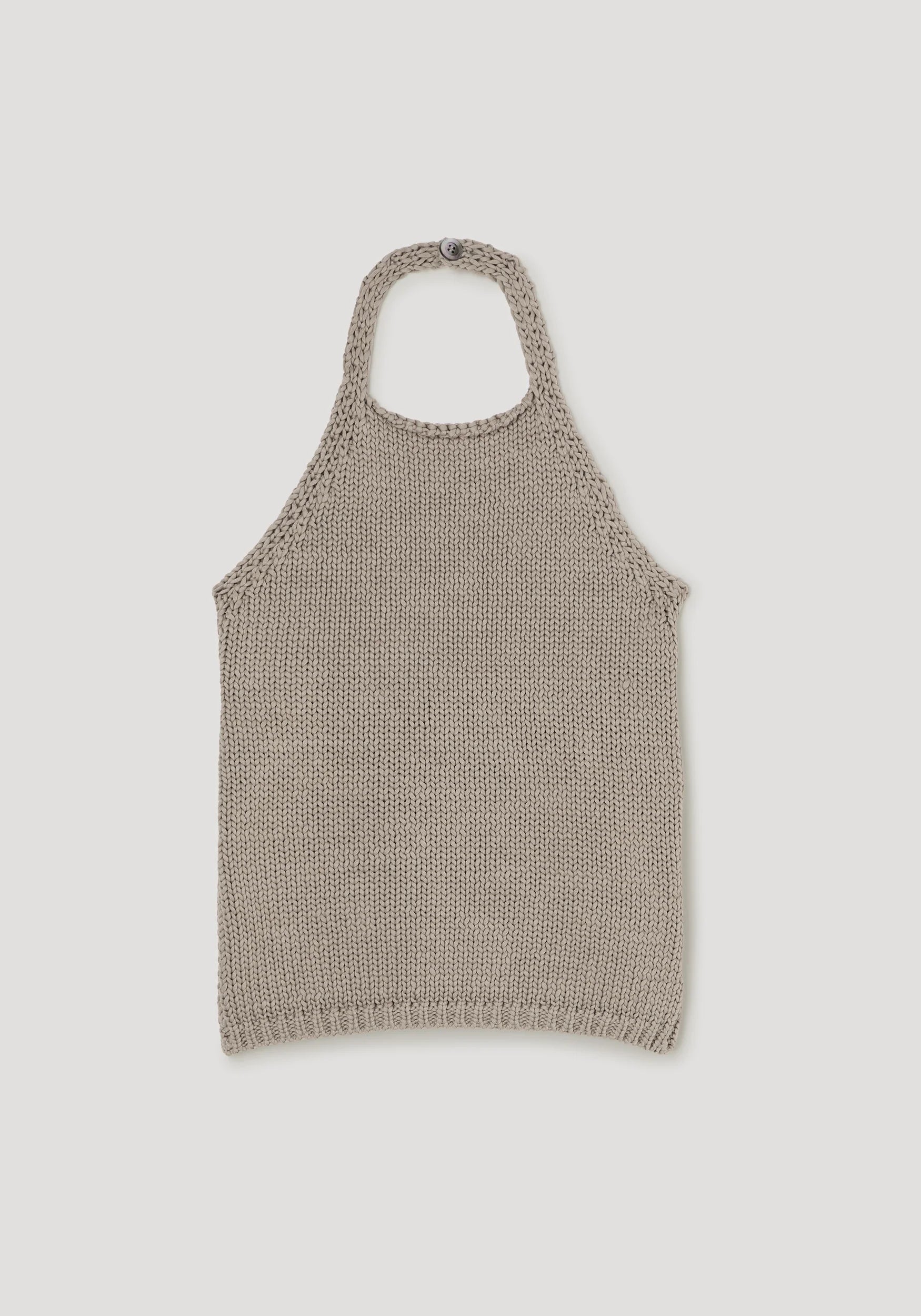 Knitted tank top on a light gray background