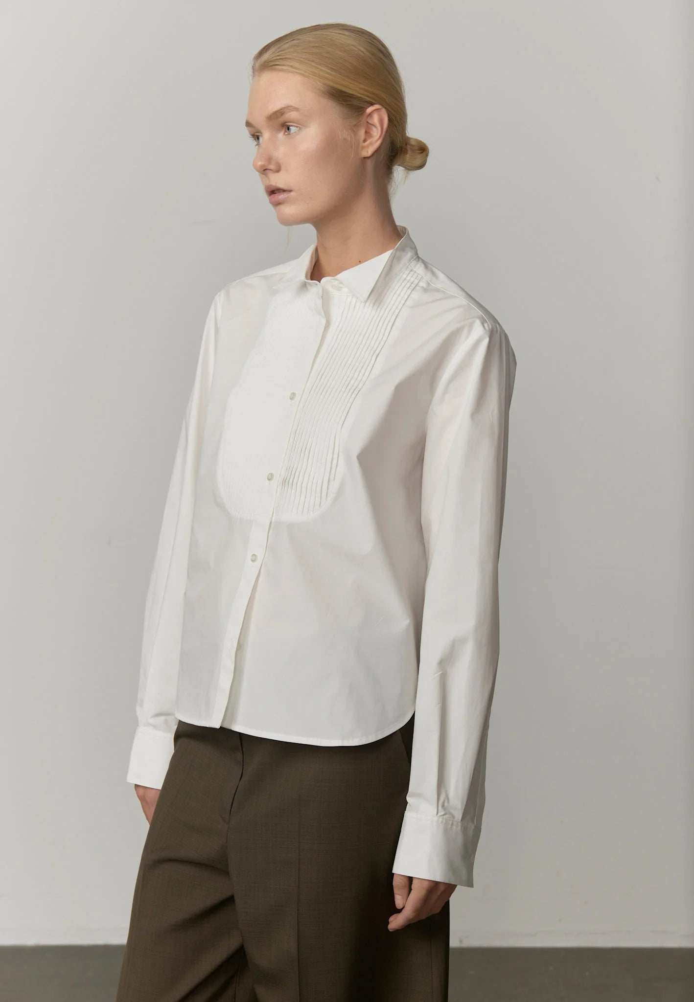 Side view highlighting the fitted silhouette