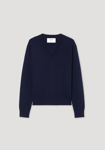 A black long-sleeve cropped cardigan with a round neckline and a vertical row of gold buttons down the front, displayed on a clean white background.