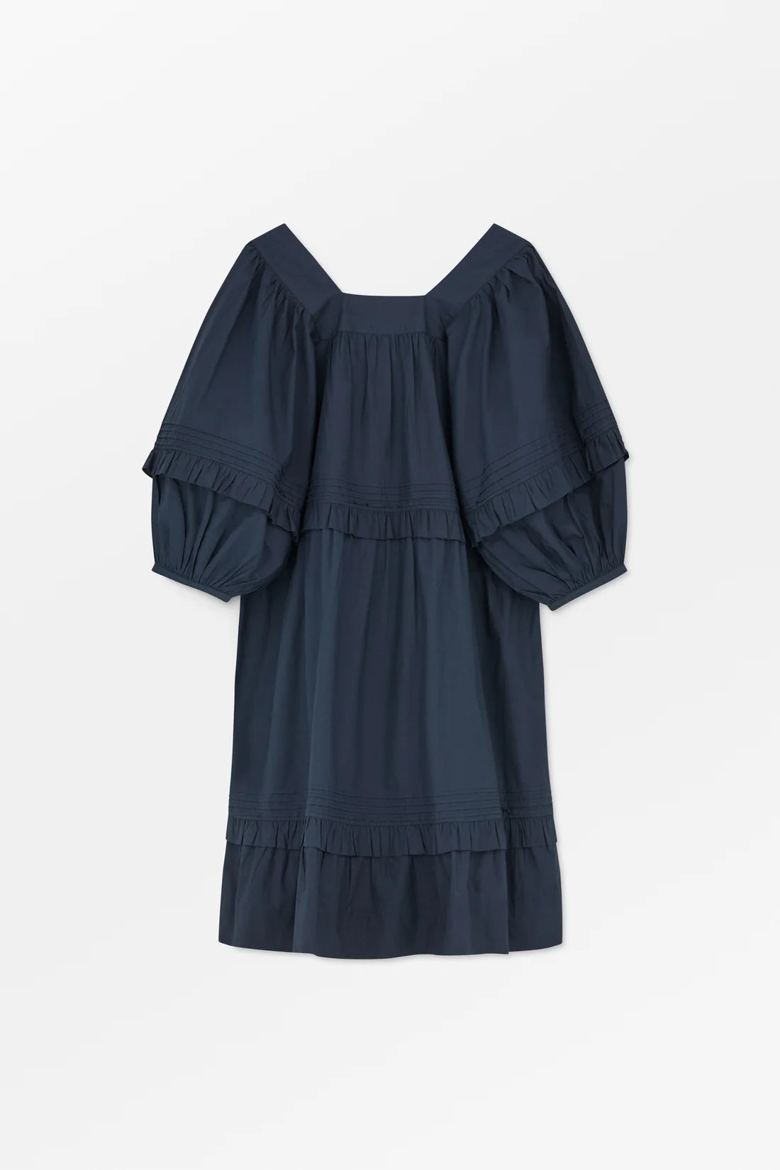 Navy blue dress with ruffled sleeves and bottom on a white background