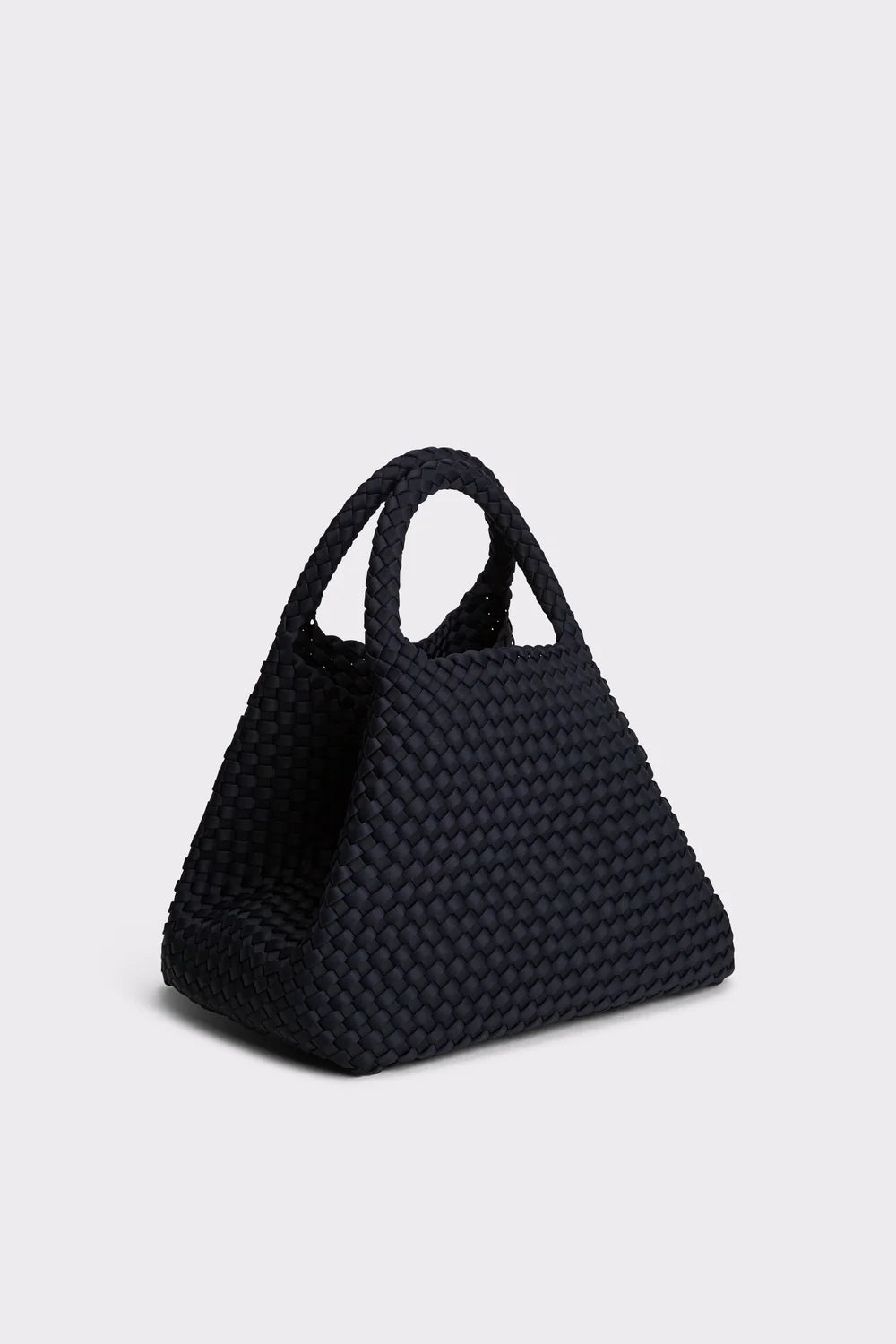 A small black woven basket bag with two top handles, photographed on a light gray studio background.