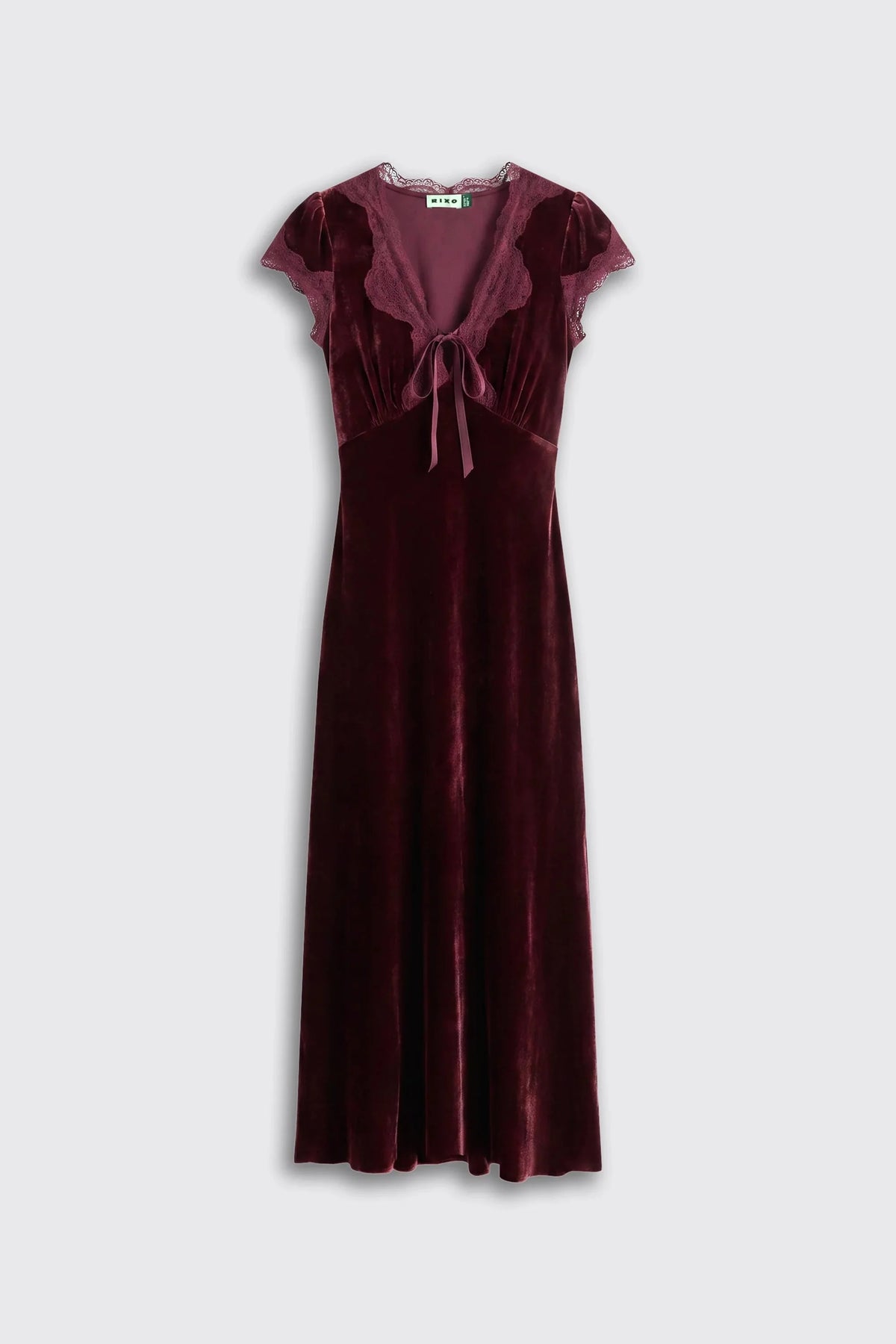 A dark burgundy velvet midi dress with cap sleeves, a ruffled deep V-neckline, and a front tie detail, shown against a light gray background.