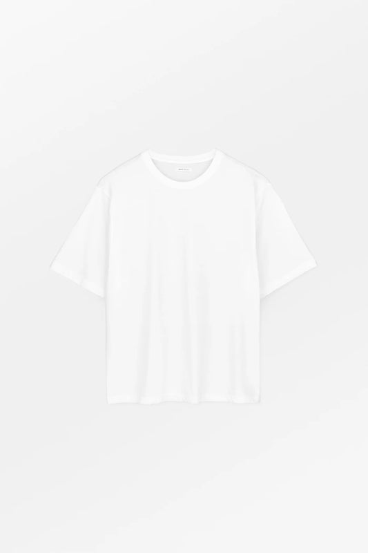 Plain white t-shirt on a light gray background