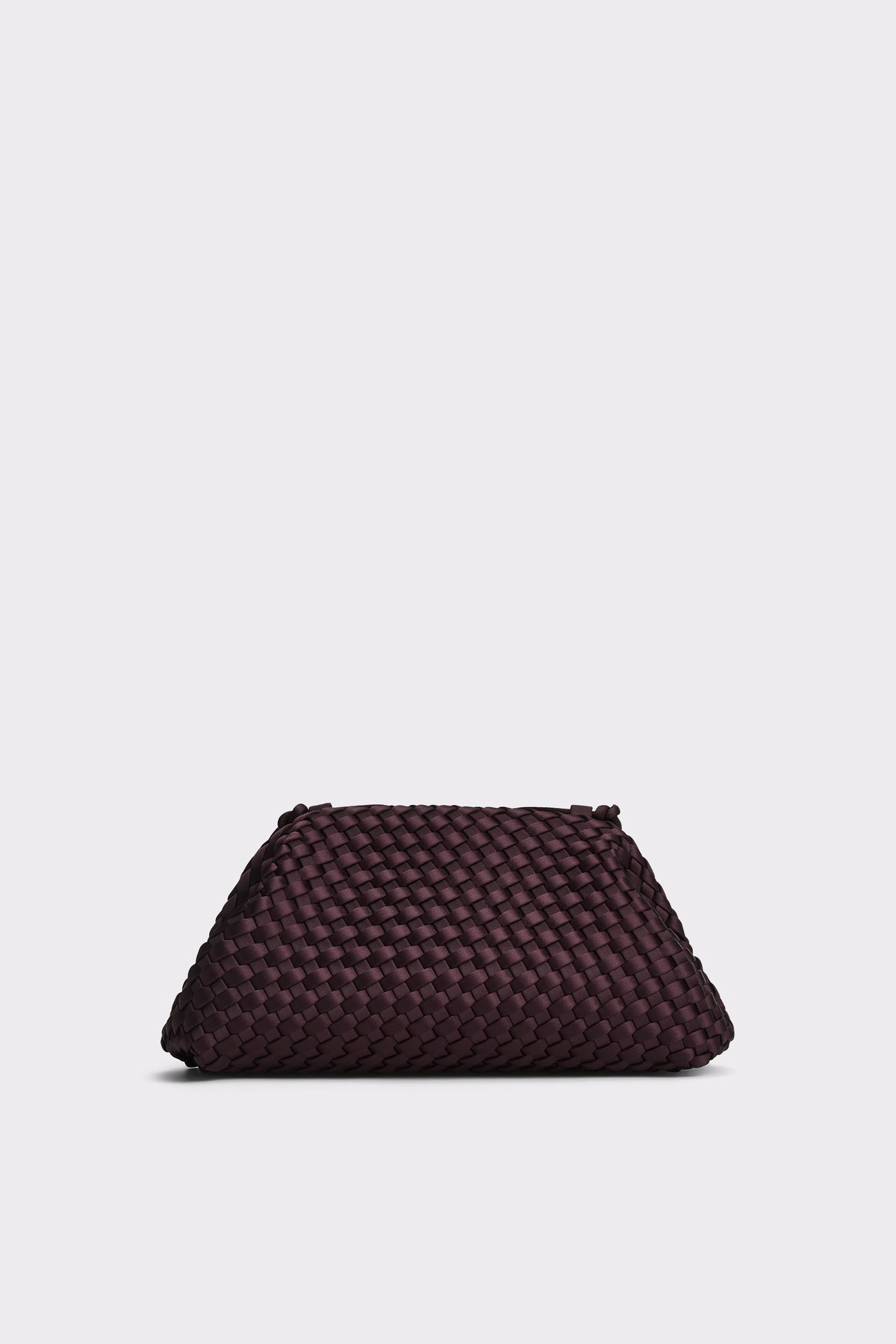 A dark plum purple woven leather clutch bag, photographed from a front angle on a light gray background.