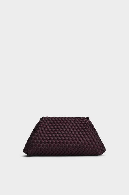 A dark plum purple woven leather clutch bag, photographed from a front angle on a light gray background.
