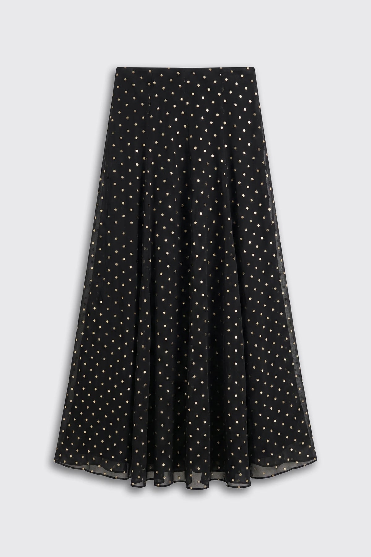 A long black skirt with a gold polka-dot pattern in a white background