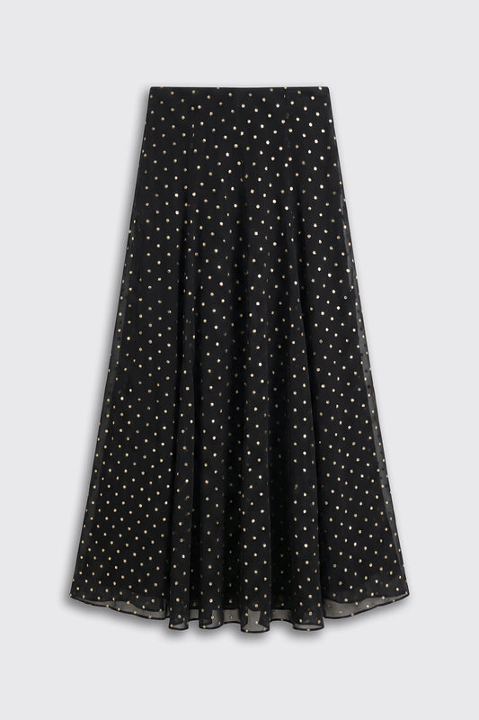 A long black skirt with a gold polka-dot pattern in a white background