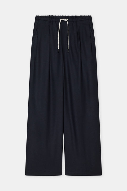 Navy wide-leg cropped pants with an elastic waistband and a white drawstring, shown flat on a light gray background.