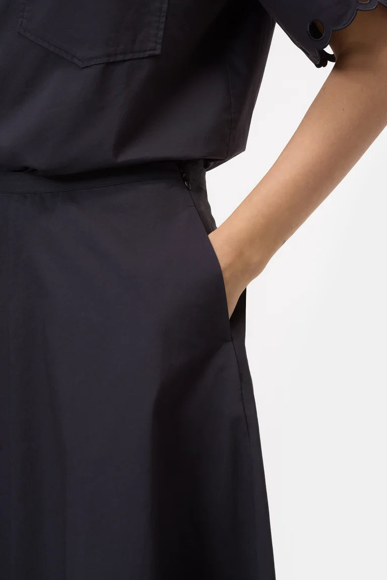 Navy blue dress with a white background