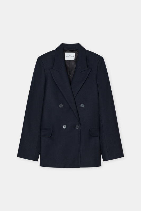A dark navy blue double-breasted blazer with notched lapels and dark buttons, displayed flat against a light gray background.