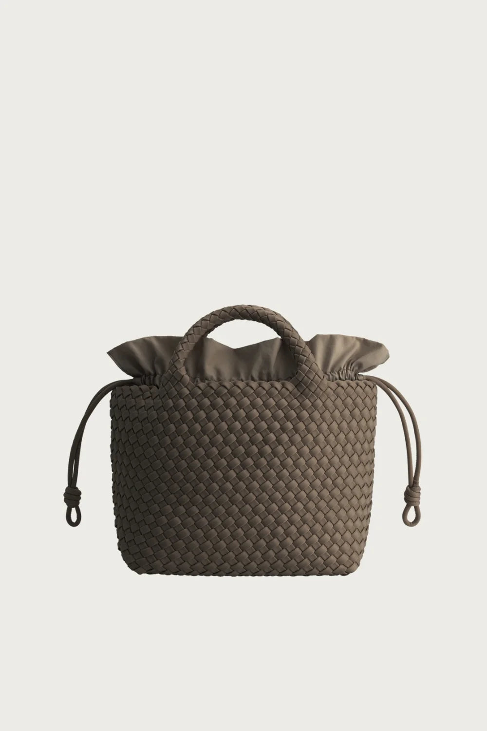 Brown woven drawstring bag on a light beige background