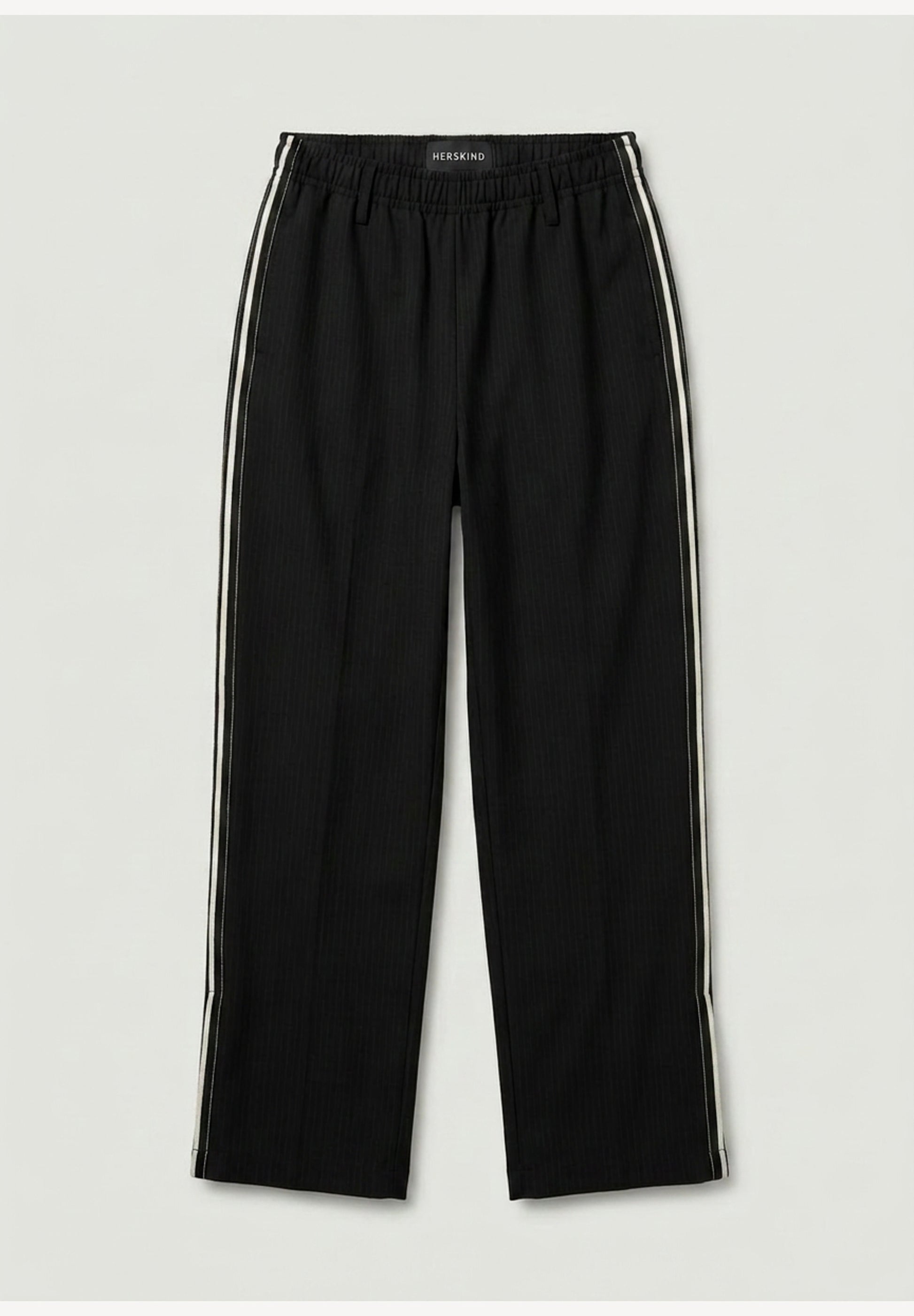 Black pants with white stripes on a light gray background
