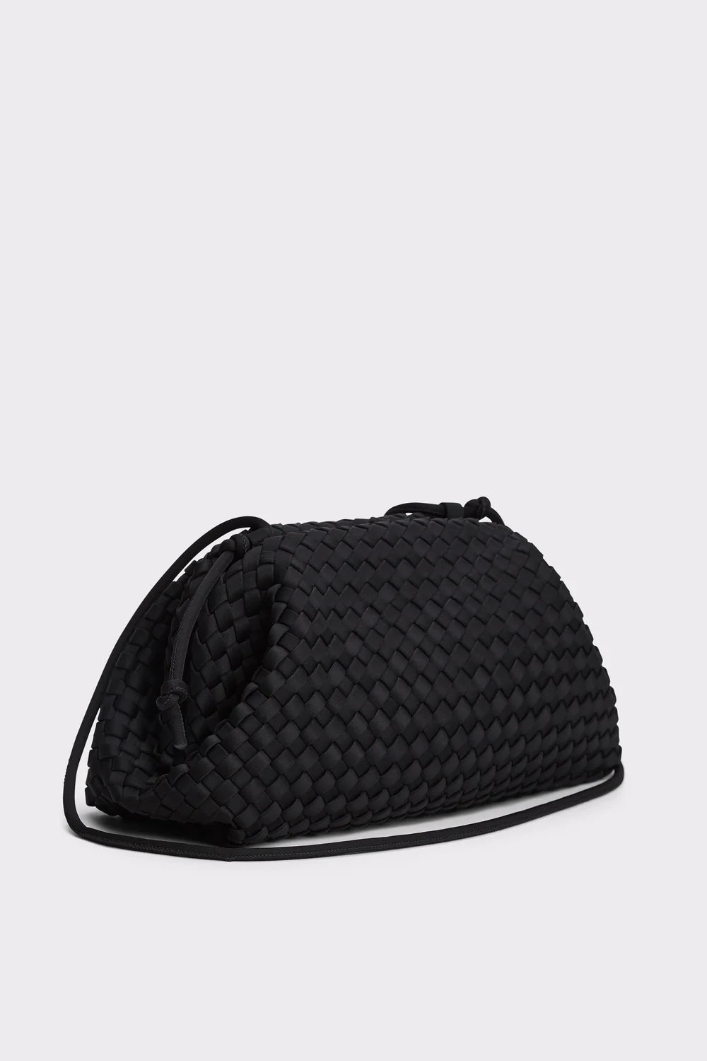 A black woven leather shoulder bag with a textured basketweave pattern and a thin black strap, photographed on a light gray background.
