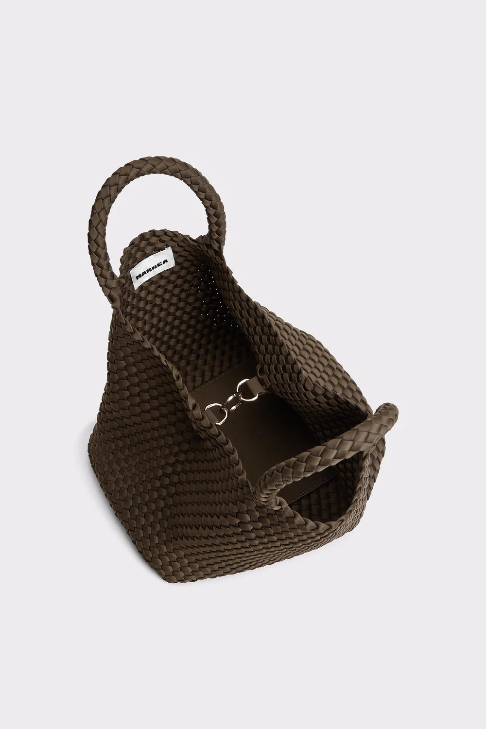 Brown woven pet bed on a light gray background