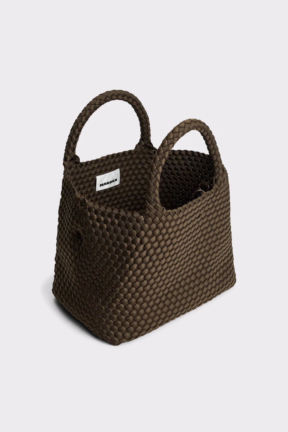 Brown woven basket with handles on a light gray background