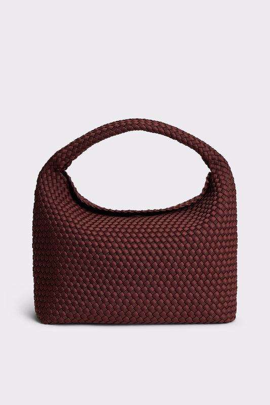 A dark burgundy woven leather handbag with a single integrated top handle, shown against a light gray background.