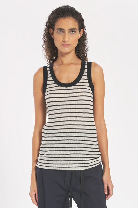 Woman wearing a striped tank top against a white background