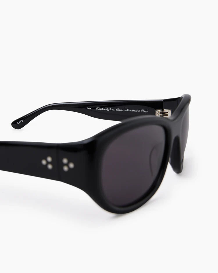 Black sunglasses with dark lenses on a white background