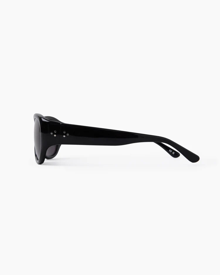 Black circular object on a white background