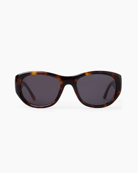 Sunglasses with tortoiseshell frame and dark lenses on a white background