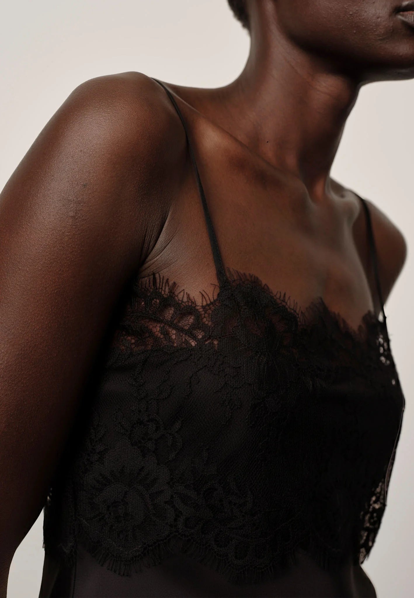 Black lace lingerie on a neutral background
