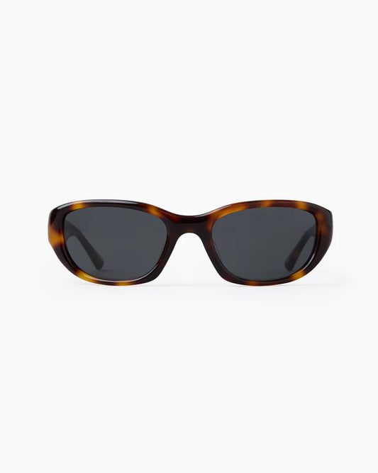 Sunglasses with tortoiseshell frame on a white background