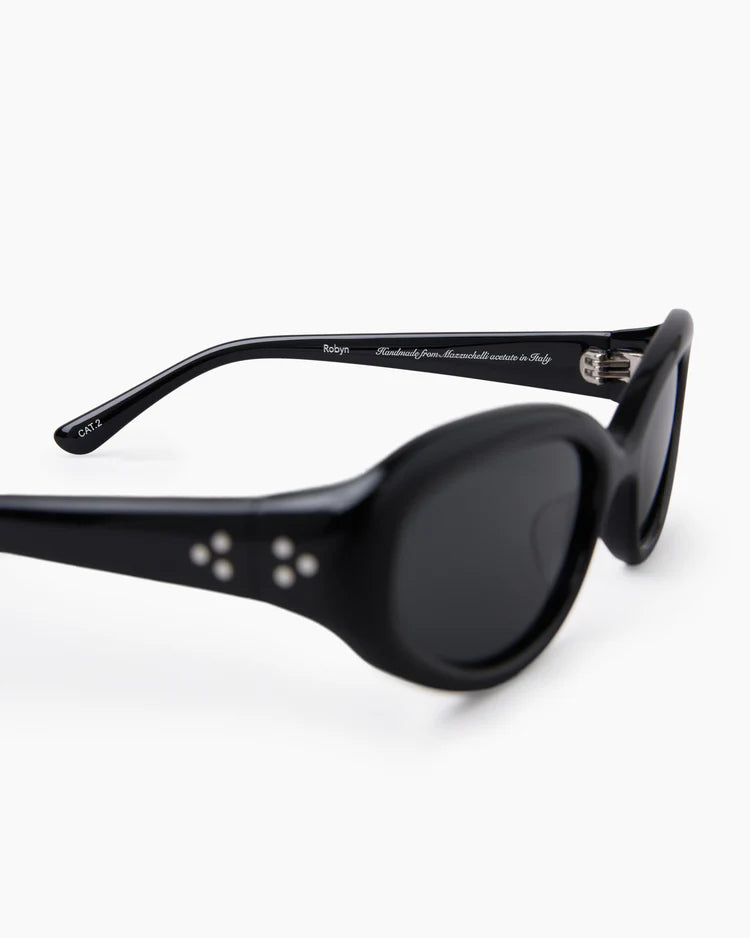 Sunglasses with black frame and dark lenses on a white background