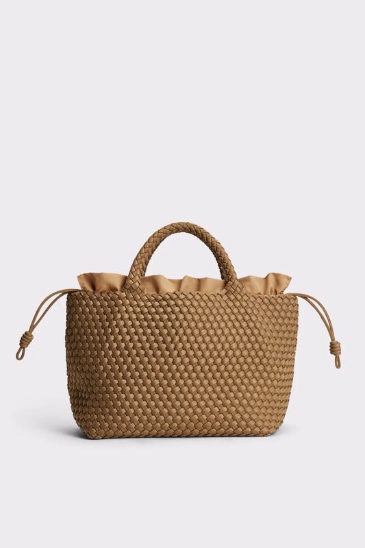 A tan woven leather handbag with a ruffled top trim, dual top handles, and drawstring side details, shown against a light gray background.