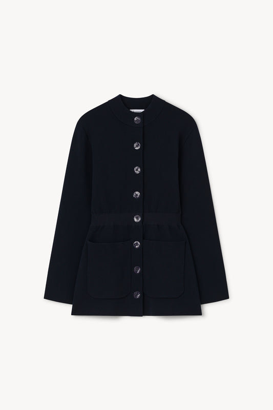 A black long-sleeve jacket with a buttoned front, round neckline, and front flap pockets, shown flat against a light off-white background.