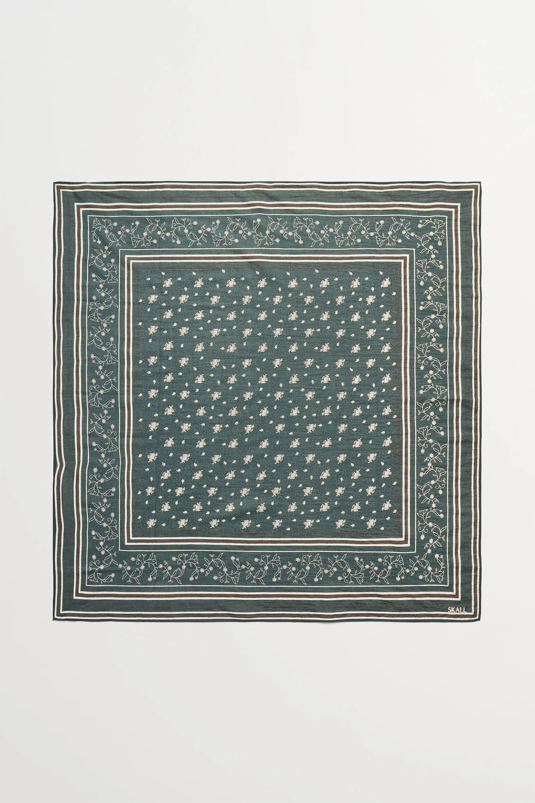 A square scarf featuring a dark teal green base with a dense pattern of small white stars and a decorative border, displayed flat against a light gray background.